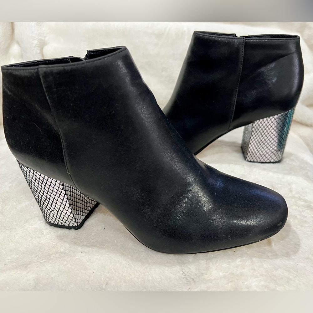 Black bootie size 8.   Faux black leather with foil printed heel